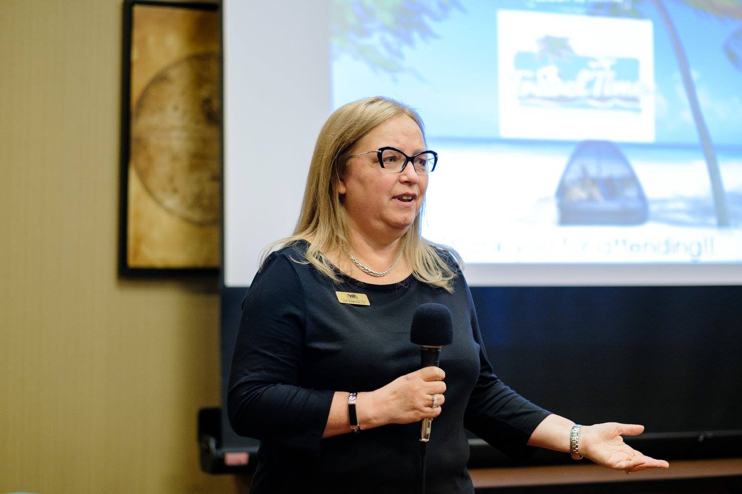 Lois Barbour presenting at a destination wedding show